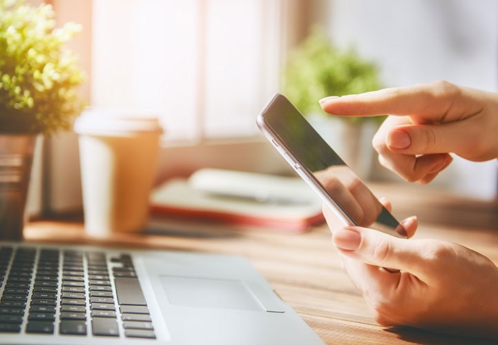 hands holding mobile phone